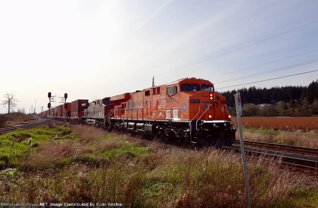 CP 8757, "Every Child Matters" with CP 9757, E/B through Colebrook from Robert's Bank with a unit stack train.